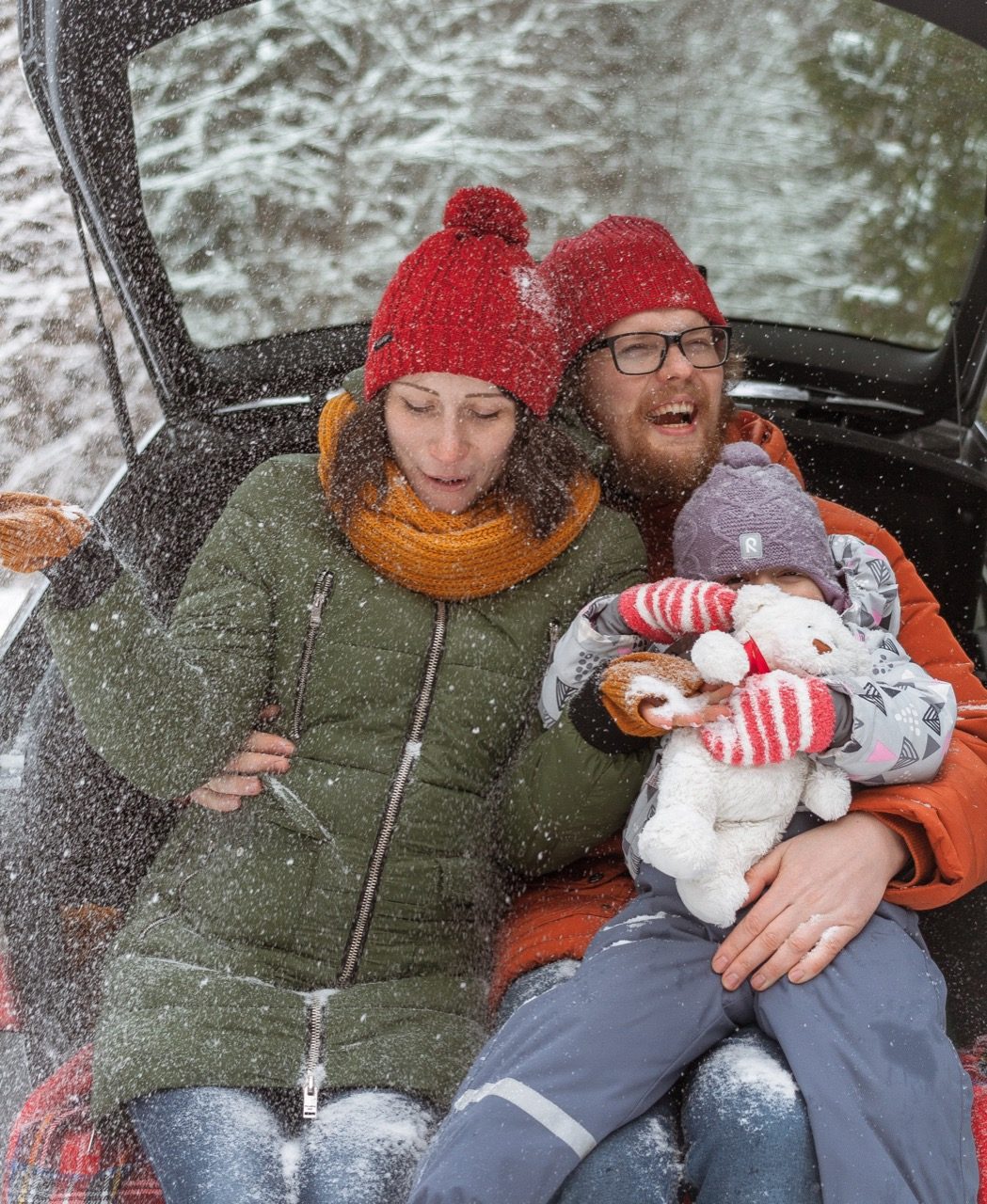 A family enjoying the snowfall.