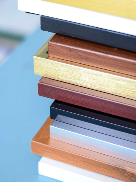 stack of metal and wood frames close up