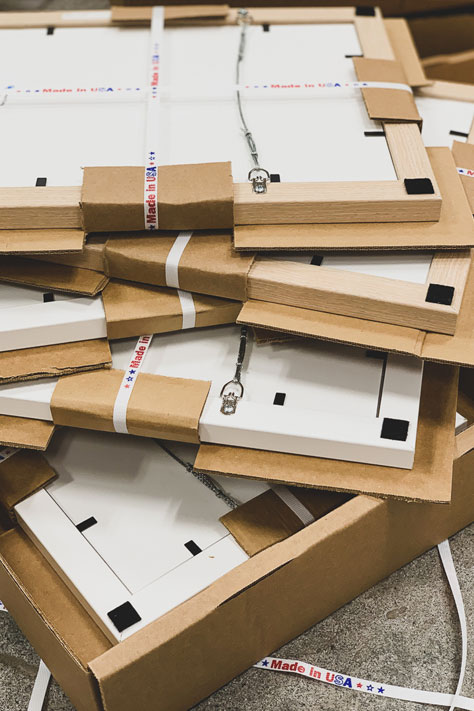 bundled stack of custom frames ready for shipping