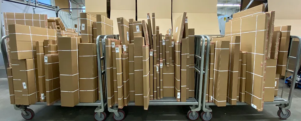 bundled stack of custom frames ready for shipping