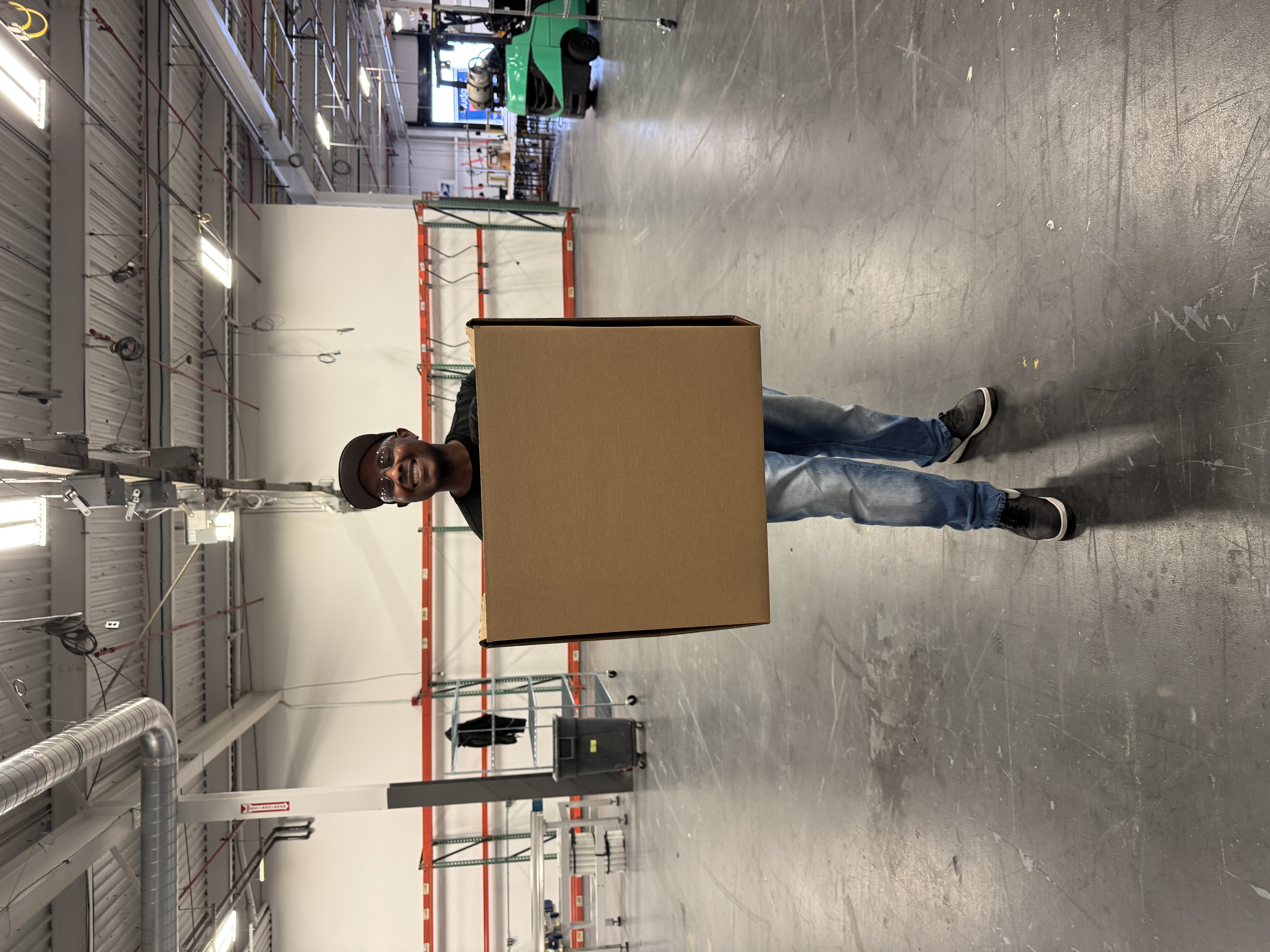 worker holding a custom-sized box