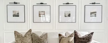 gallery wall of four black square picture frames