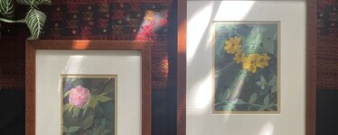 two art prints in wood picture frames