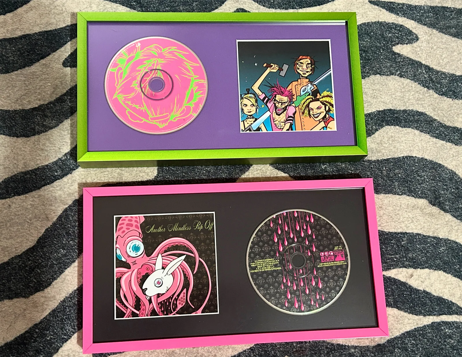 Two colorful collage frames displaying CDs and album artwork