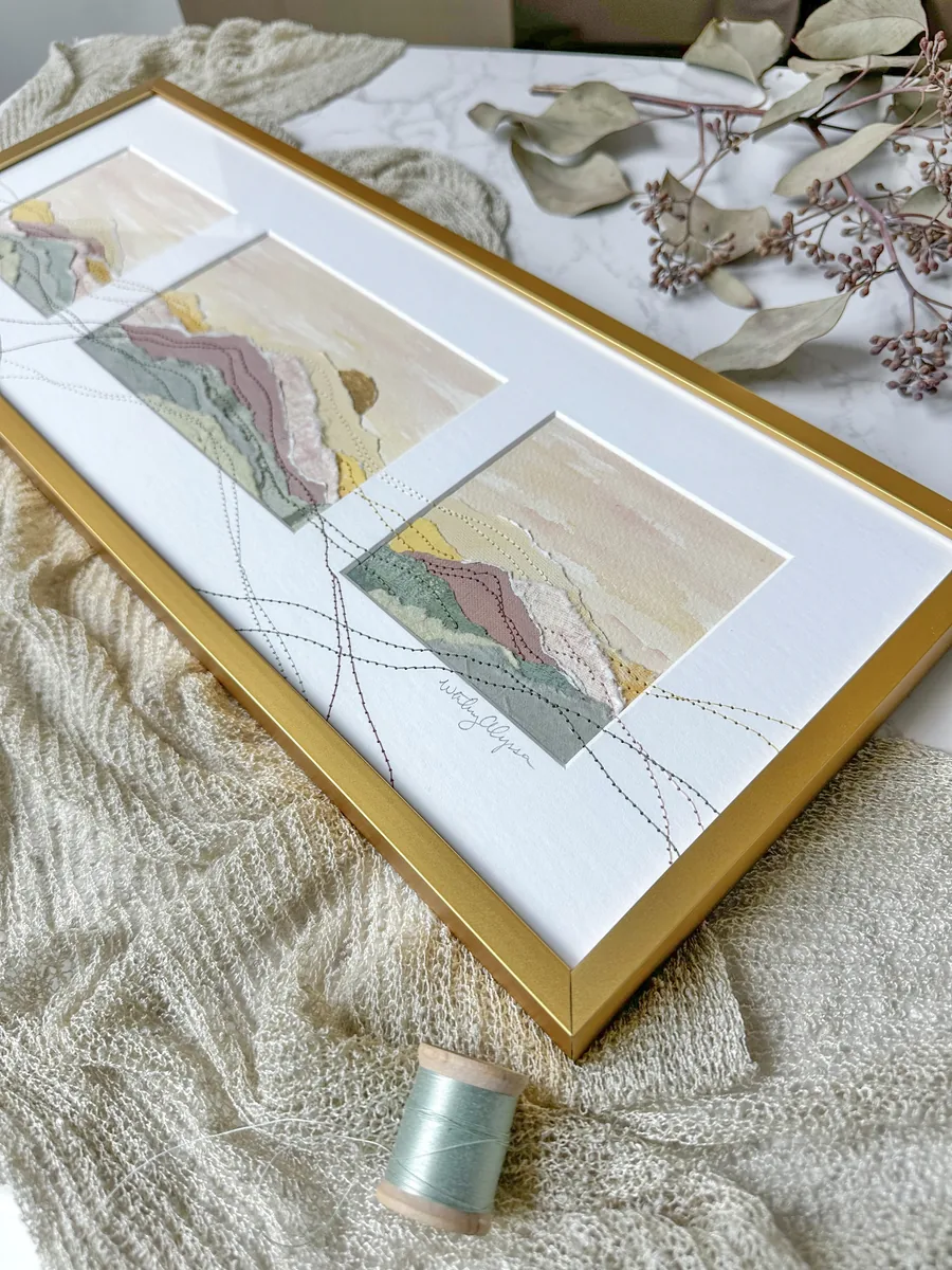 Gold collage frame displaying three embroidered landscape artworks