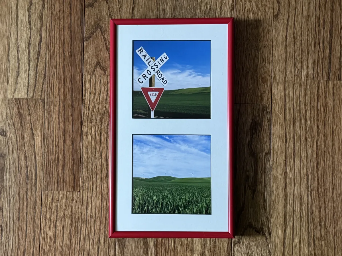 Red two-opening collage frame with a railroad crossing photo and a landscape photo