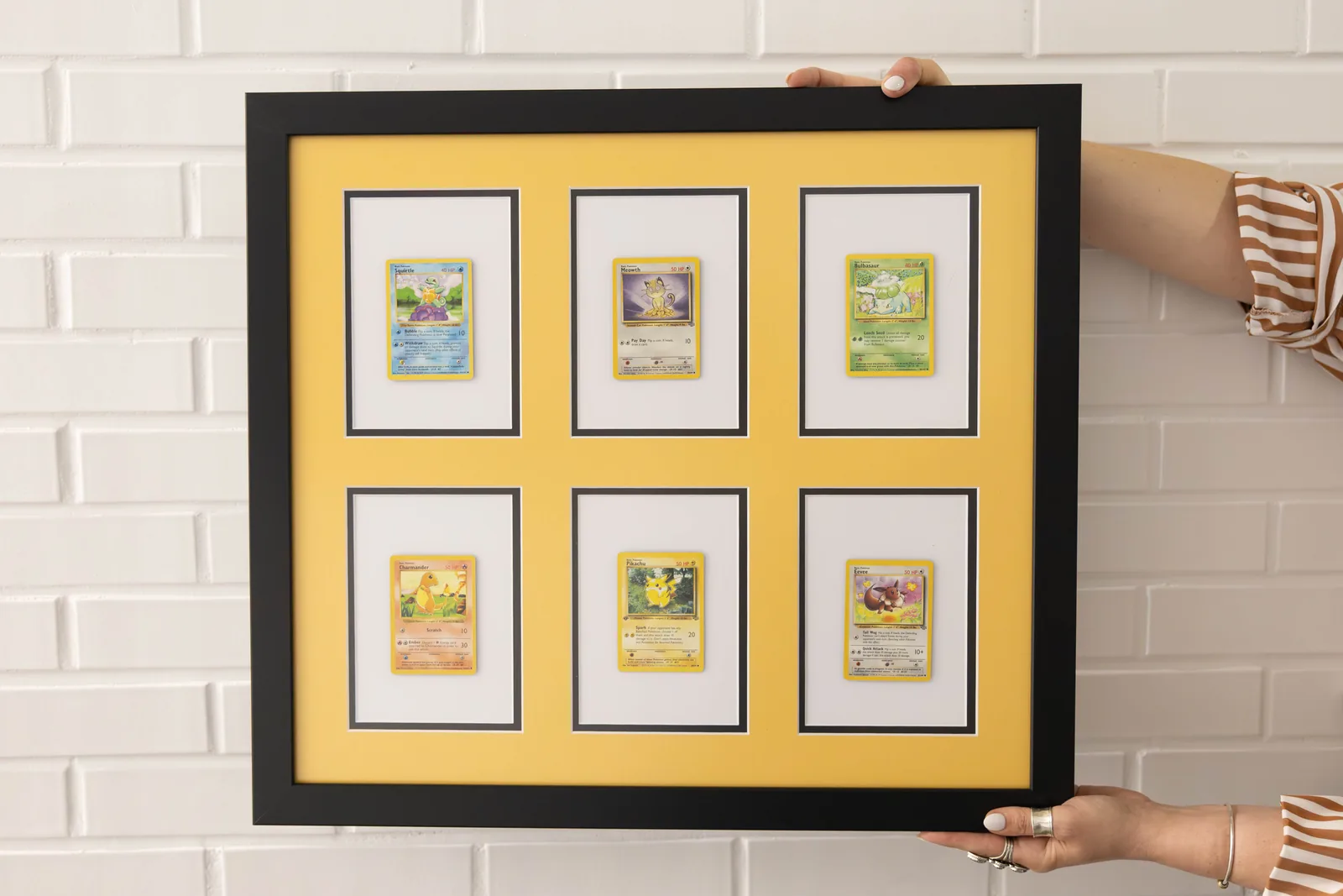 Collage frame of a trading card collection with a yellow matboard