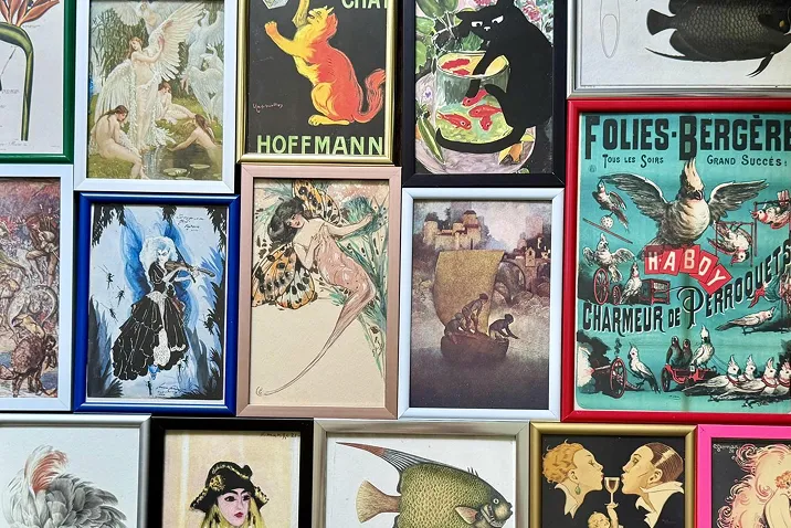 wall of framed art pieces