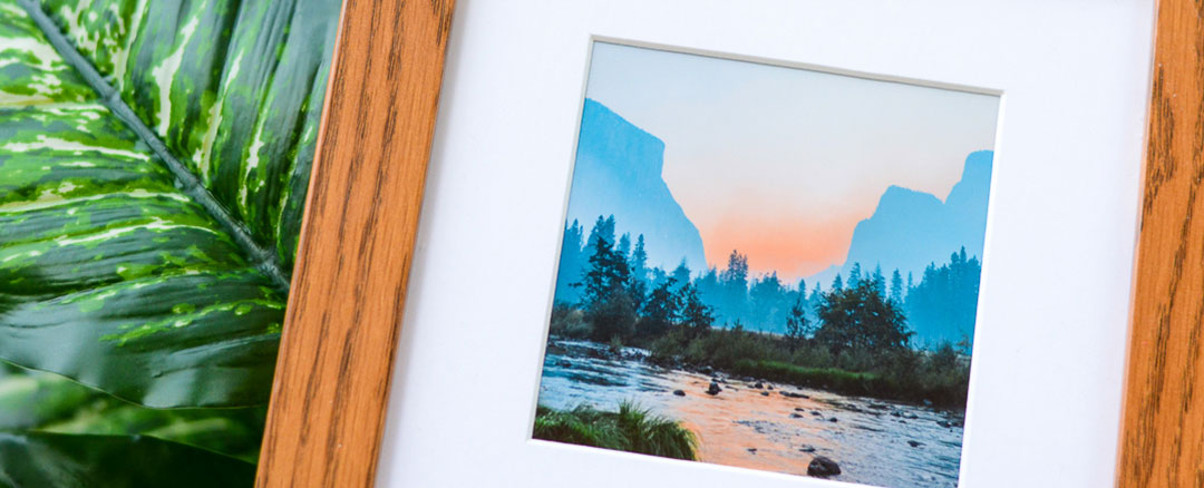Wodden framed photo of river with mountains