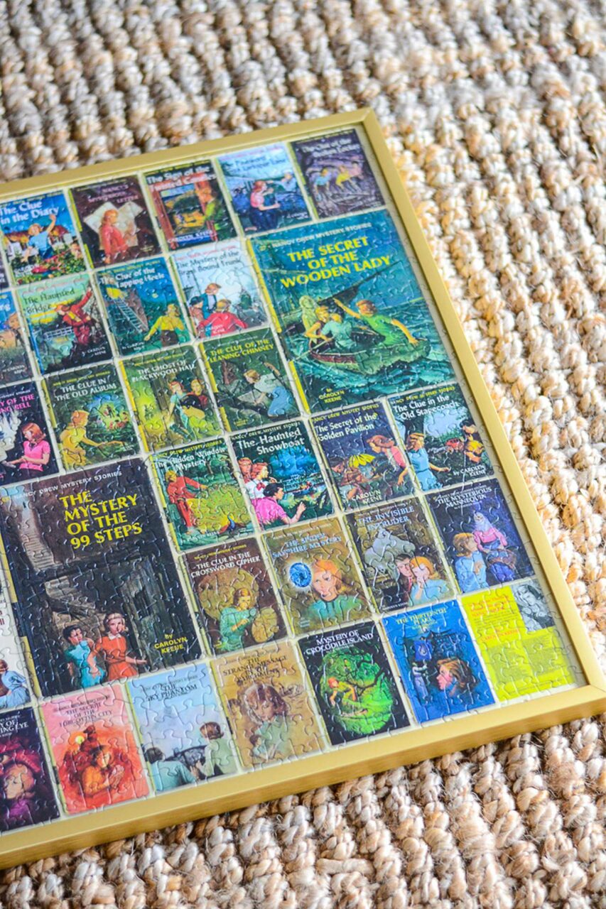 Gold framed puzzle frame of Nancy Drew books