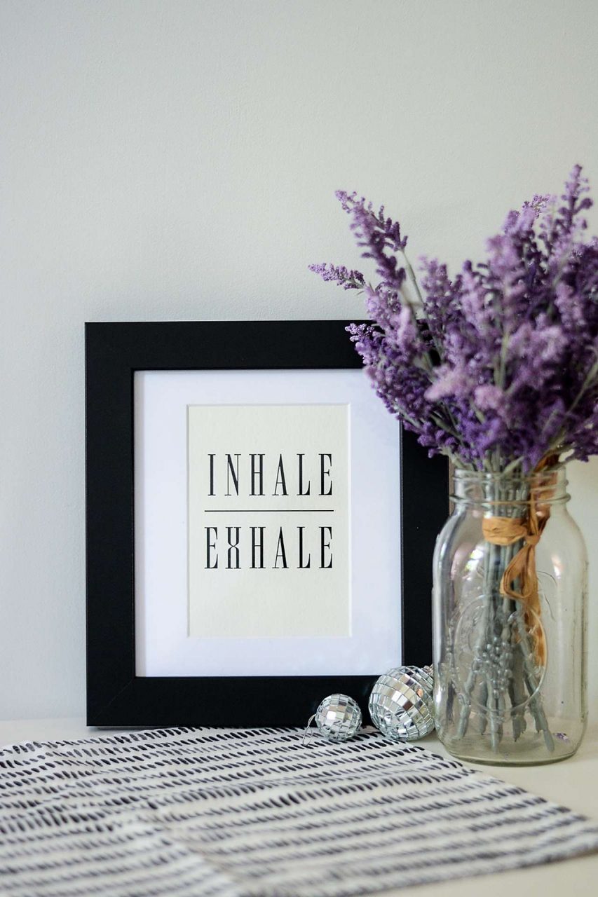 Black frame with saying, "Inhale Exhale"