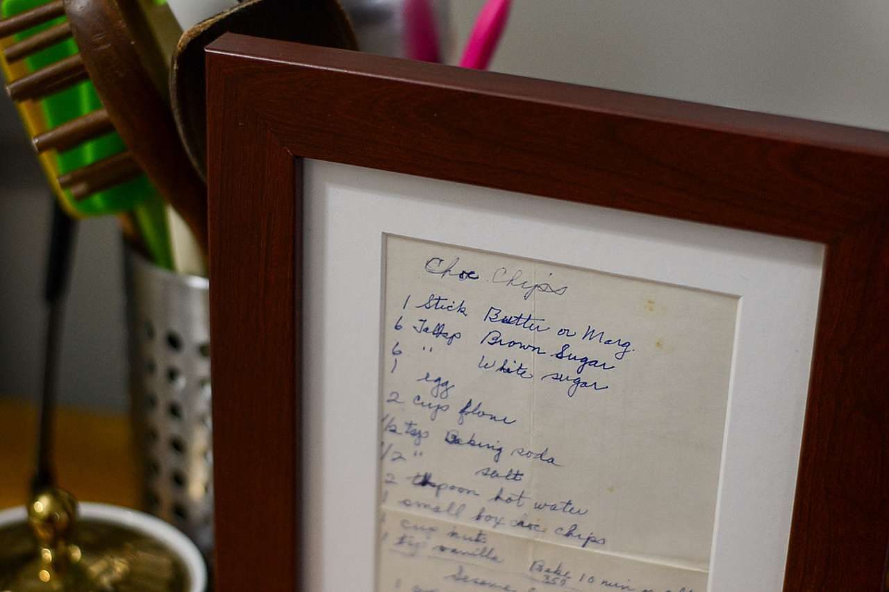 Old, handwritten recipe in a wooden frame