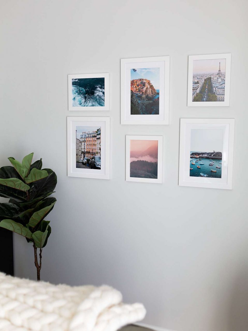 White room with white frames of world locations