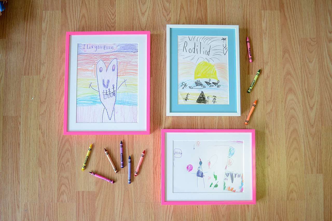 Children's crayon drawings in frames