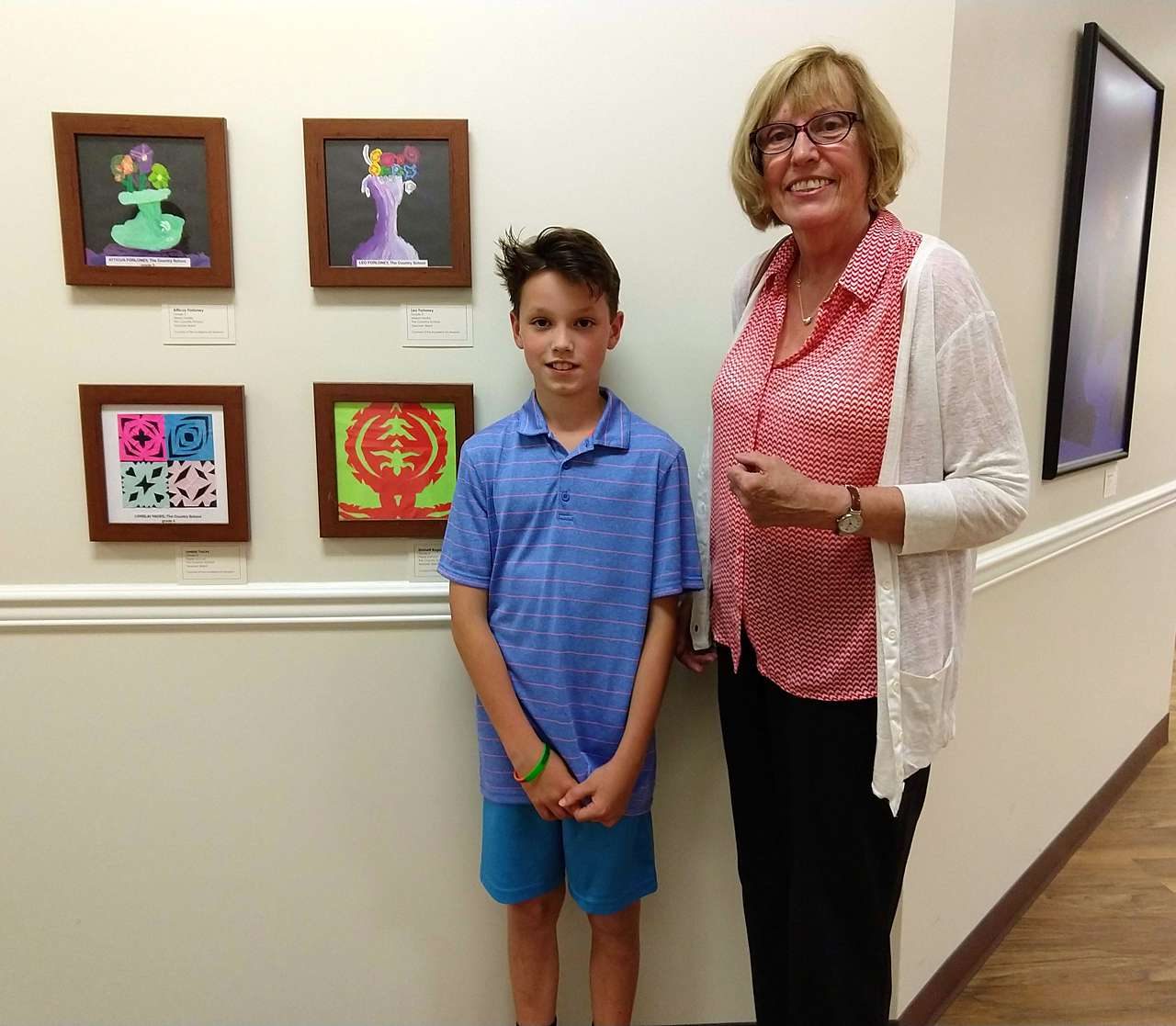 Student posing with art at Maryland Hospital