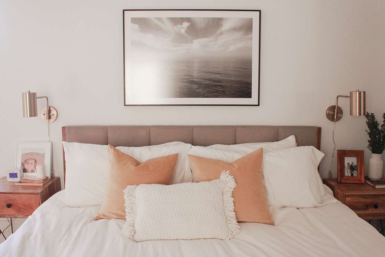 Large photo frame above bed