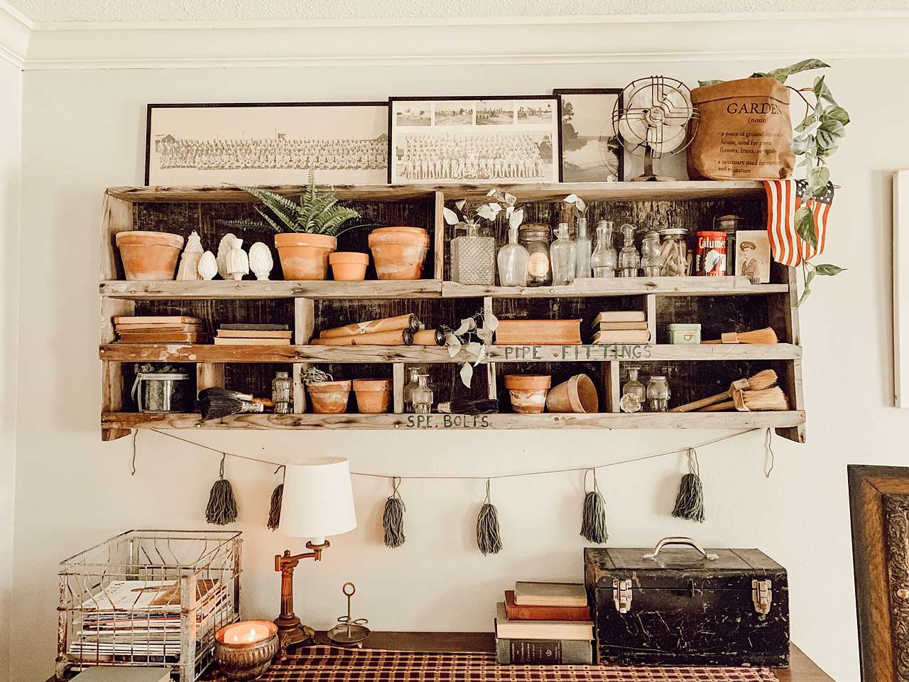 industrial style shelves with black picture frames