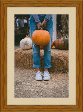 Fall art print - person holding pumpkin in front of hay - Derby in Hazel with French Vanilla matting