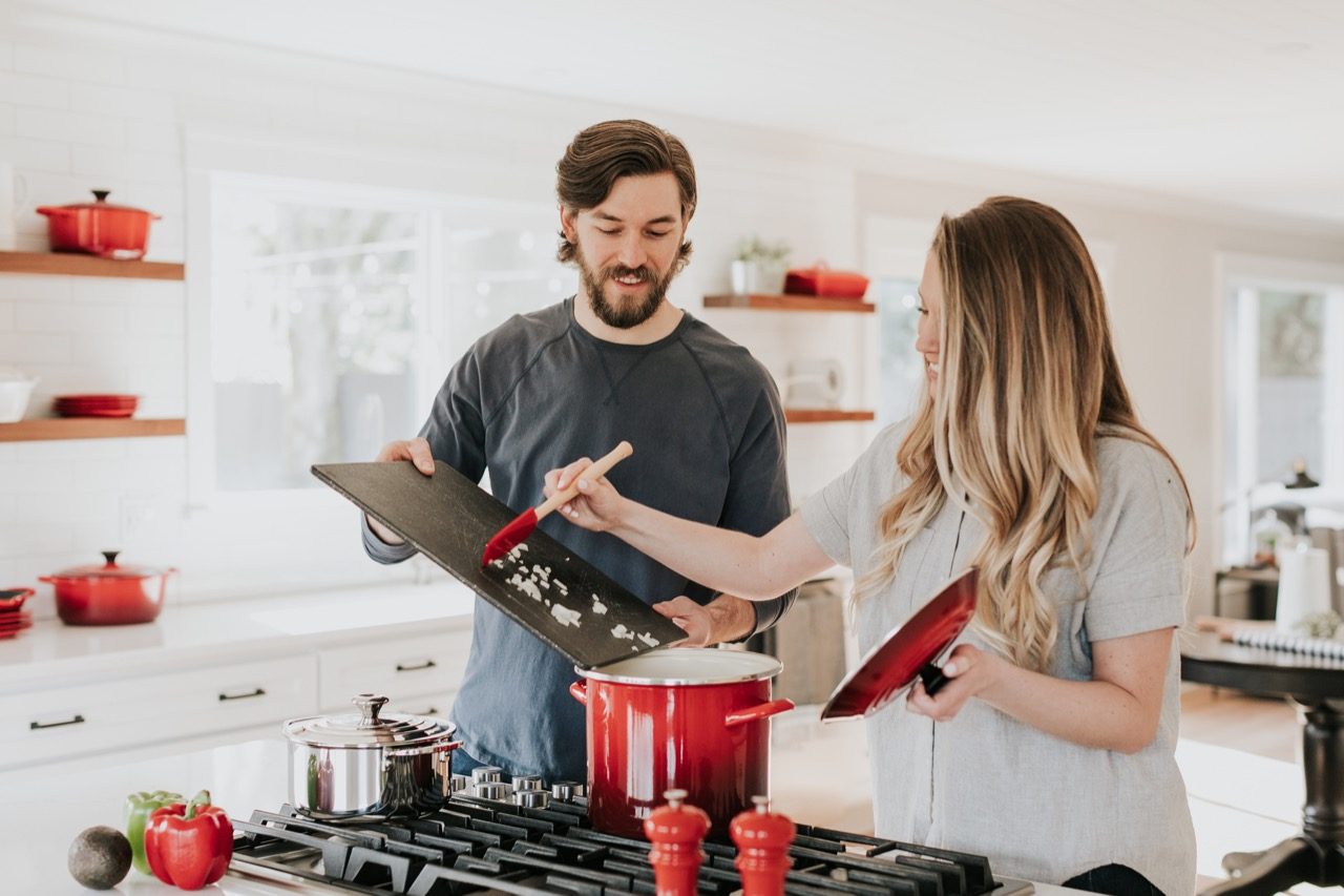 Couple cooking dinner together. 