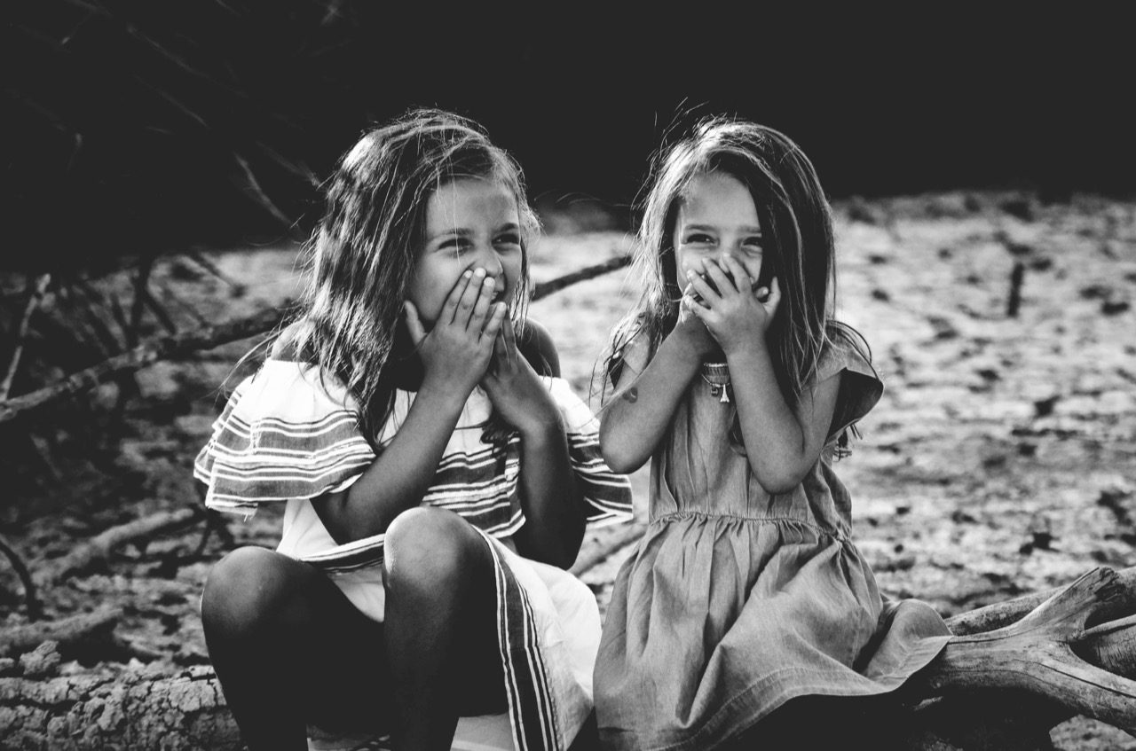 Two girls laughing. 