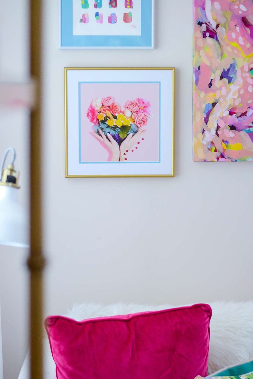 gold frame with colorful art and double matting with blue accent