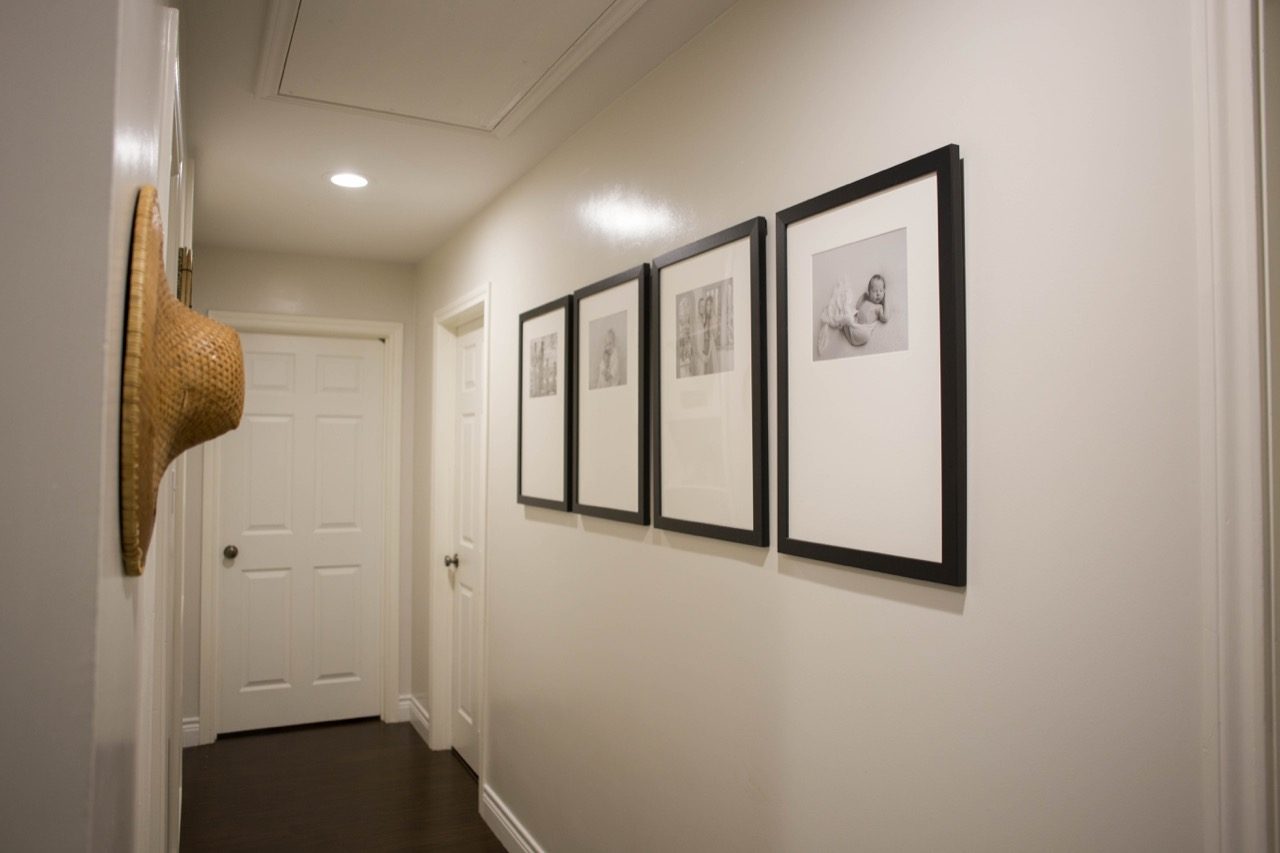 large frames on hallway wall 