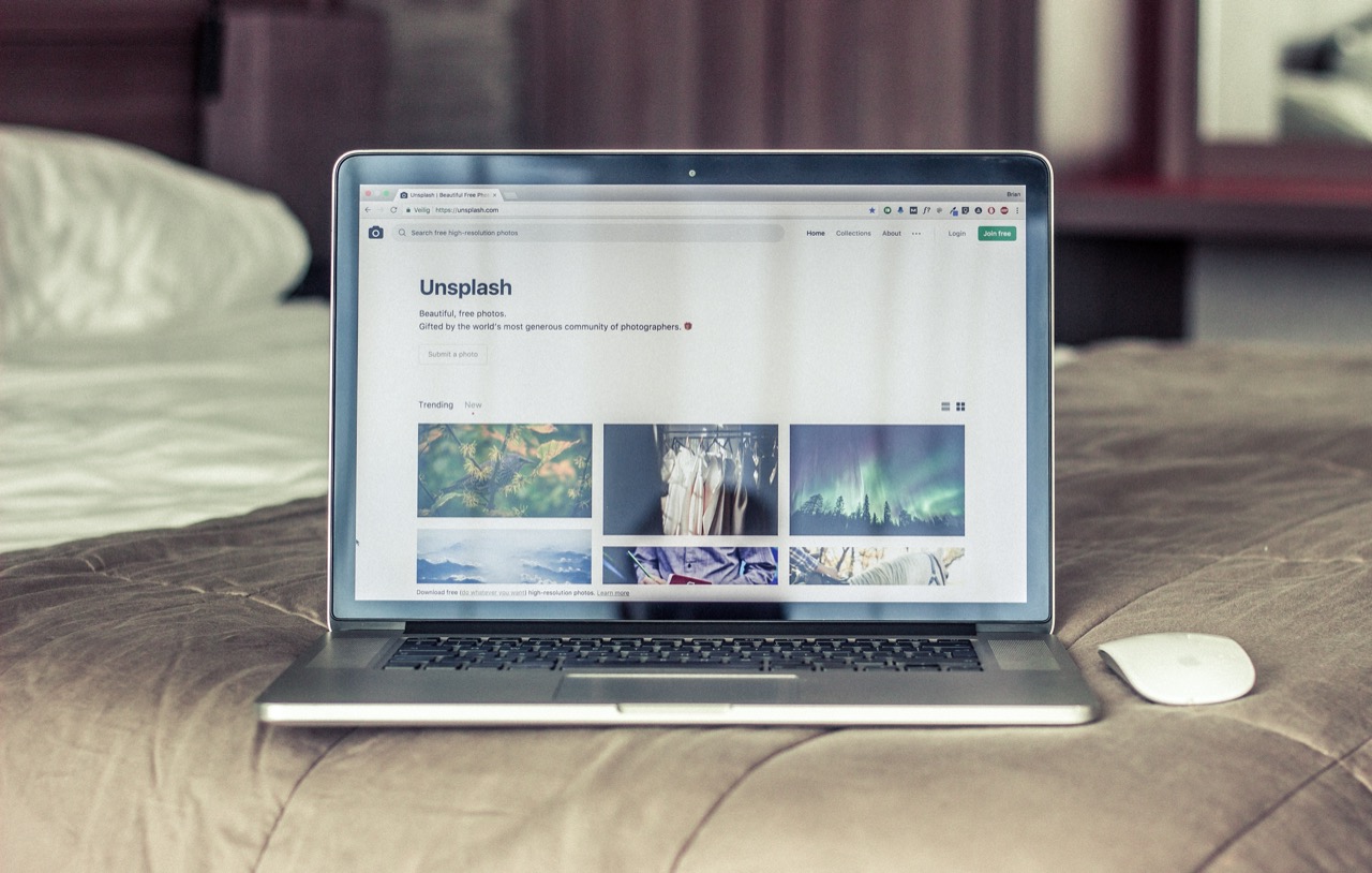 Unsplash homepage on laptop