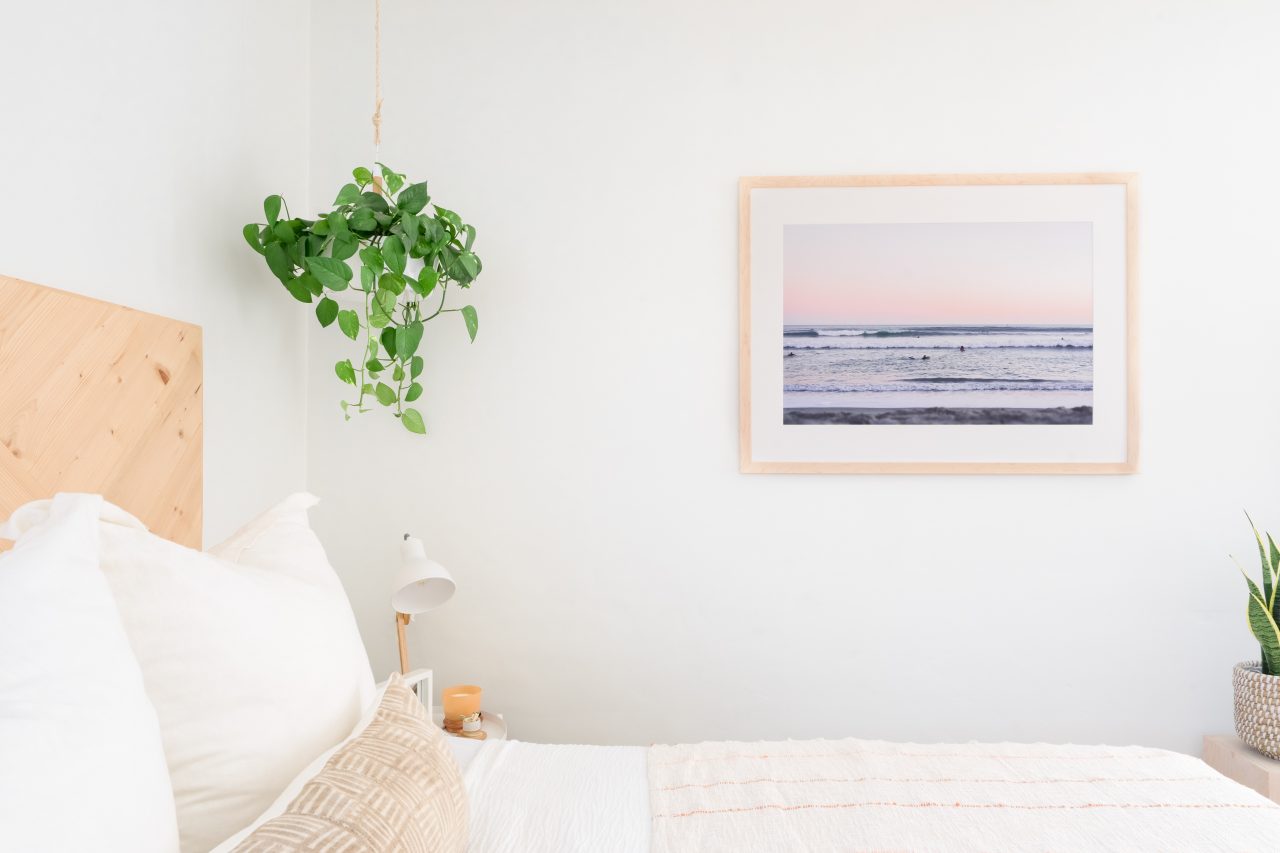 Single frame for wall decor in bedroom 
