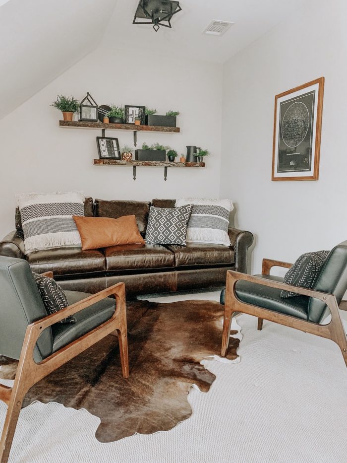 Living room in farmhouse style home with framed art