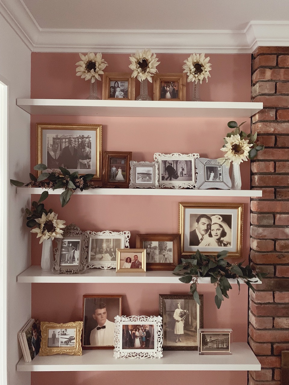 Framed photos on shelf