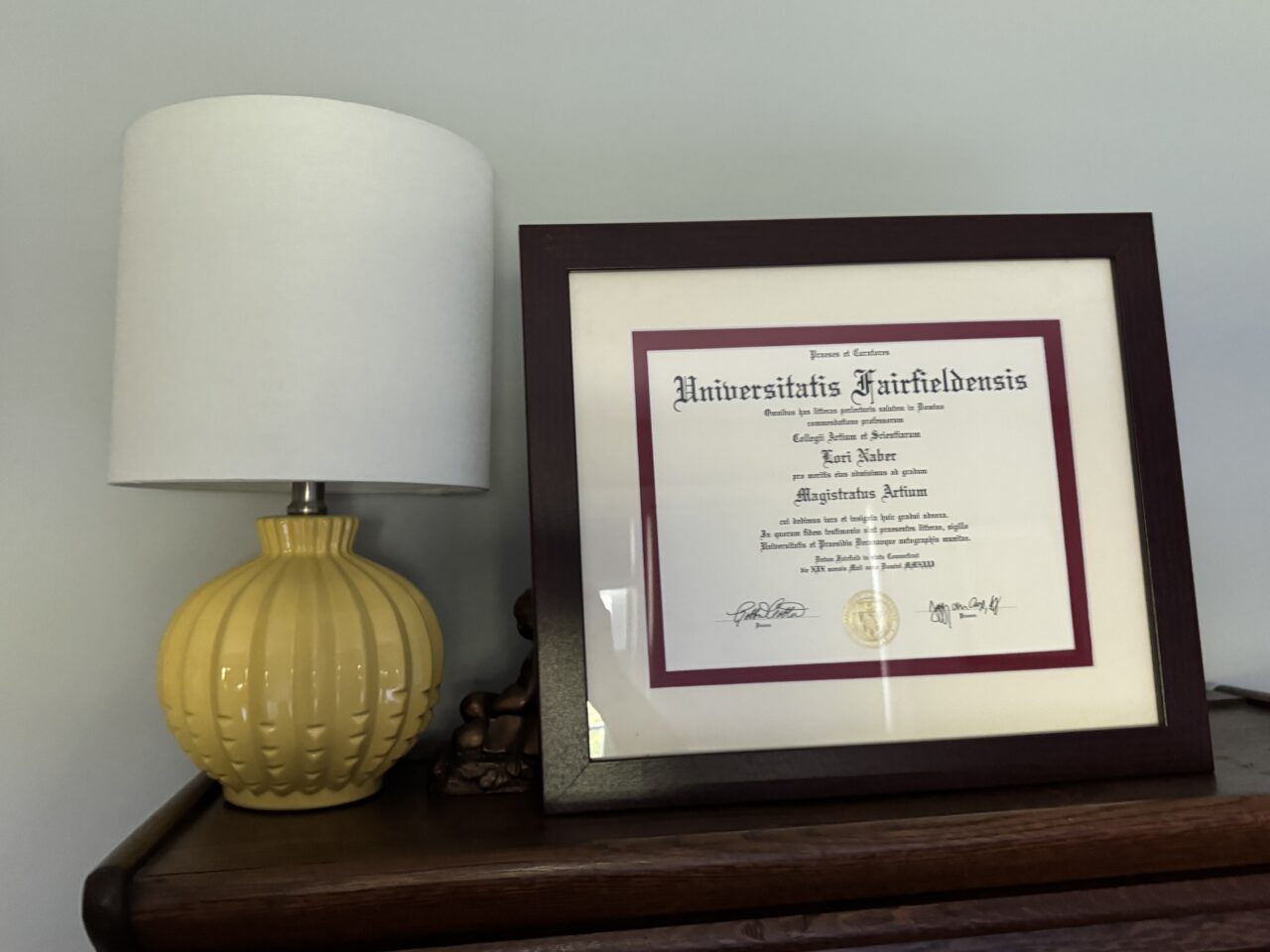 diploma framed in a wood picture frame