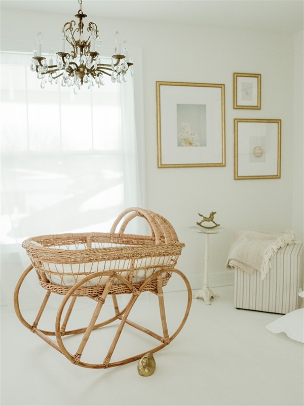 Tips For Decorating Your Nursery: a gold and white nursery and bassinet