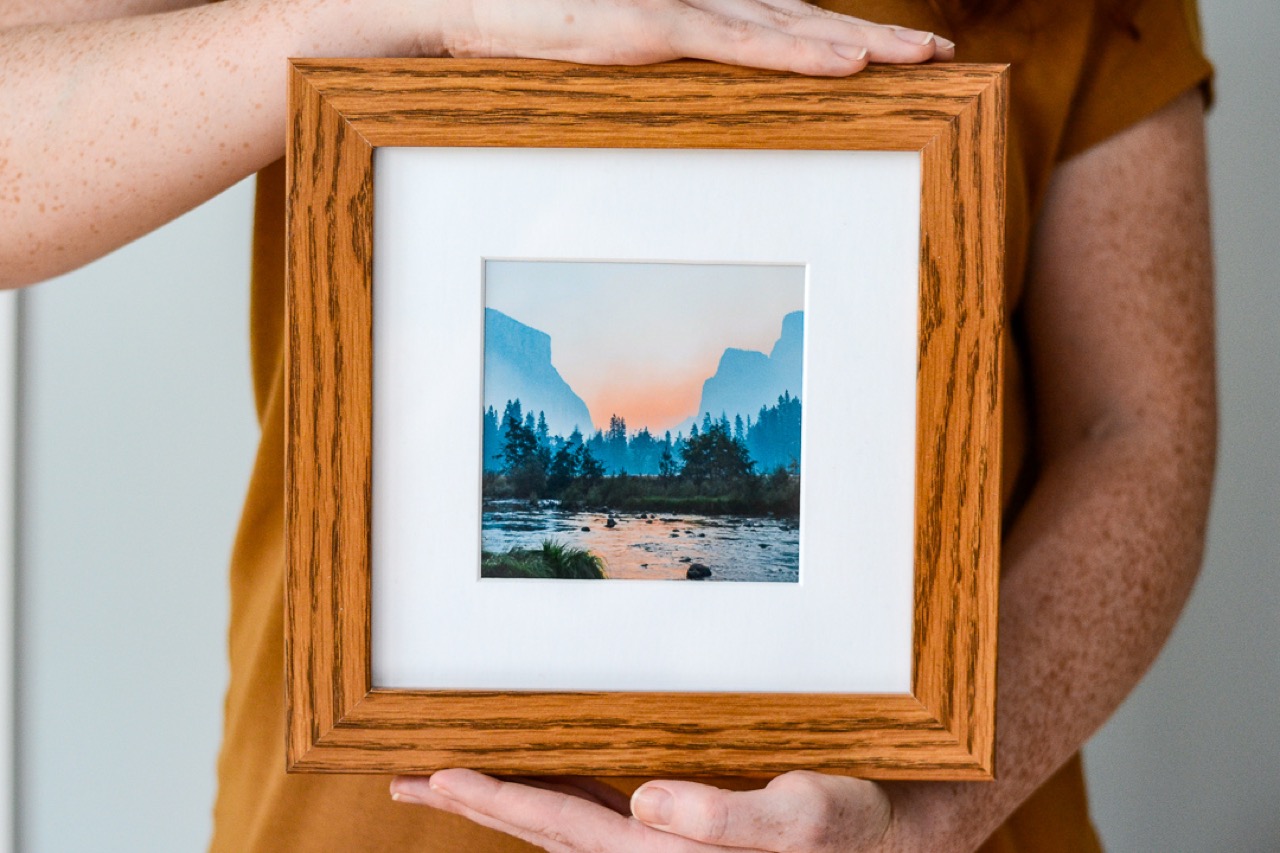 framed photo of sunset and lake 