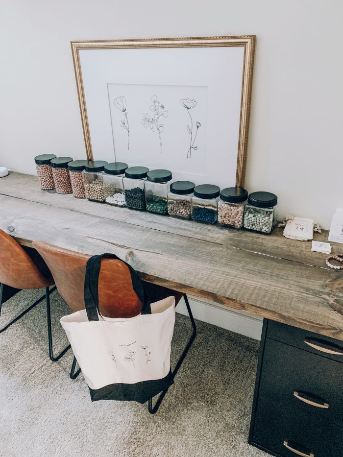 Tips for artists: Art table with chairs and containers inside the office.