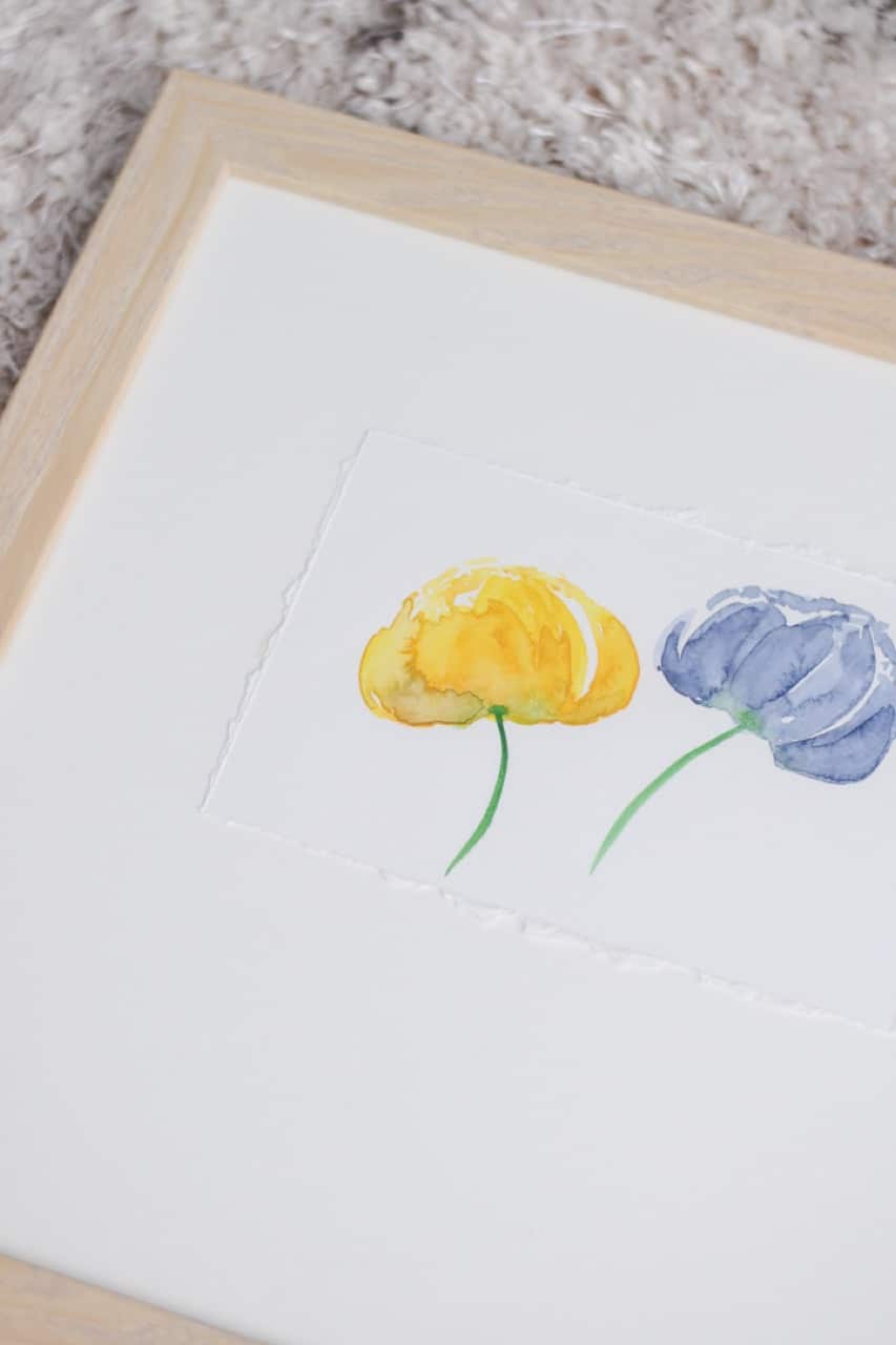 watercolor painting in light wood frame 