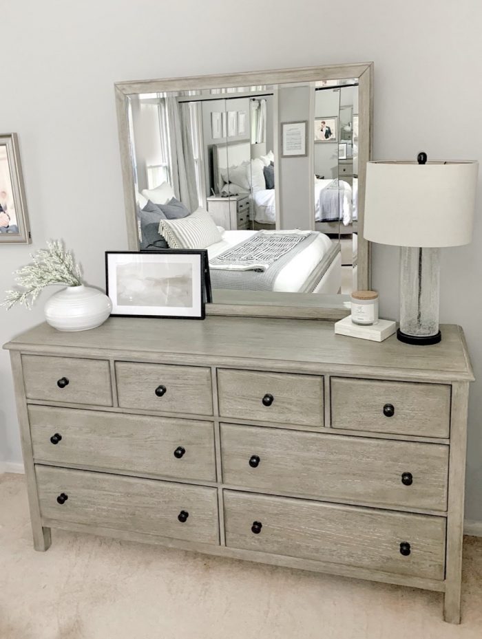 A table top frame display on a bedroom dresser