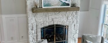 wood picture frame above a fire place