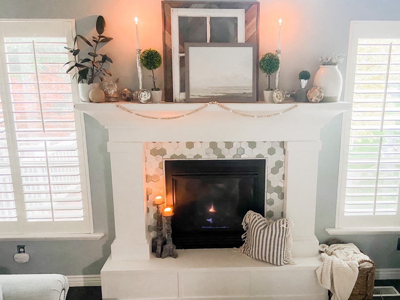 decorated fireplace mantel in living room 
