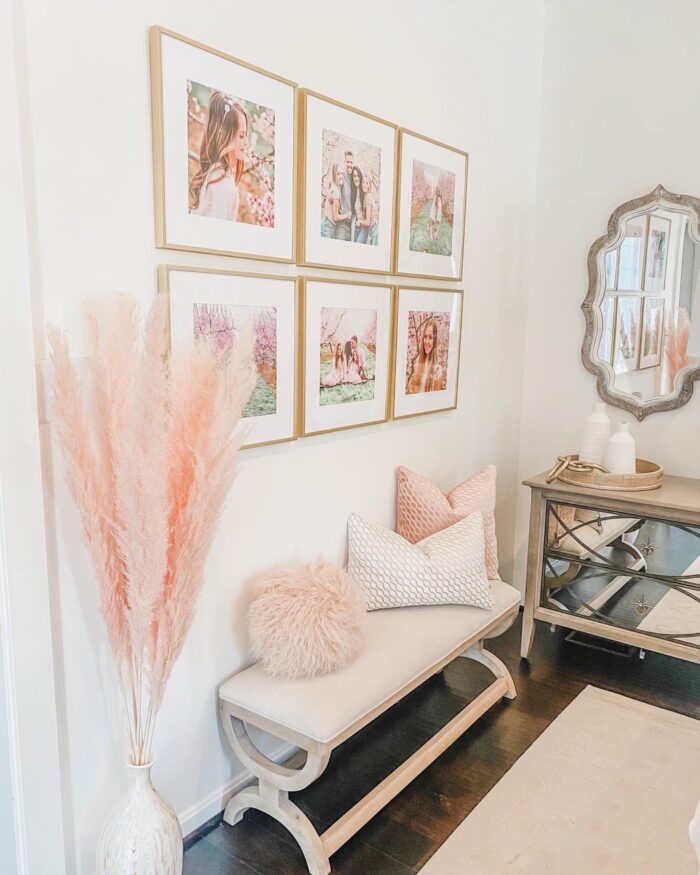 a grid style gallery wall with a pop of pastel pink! 