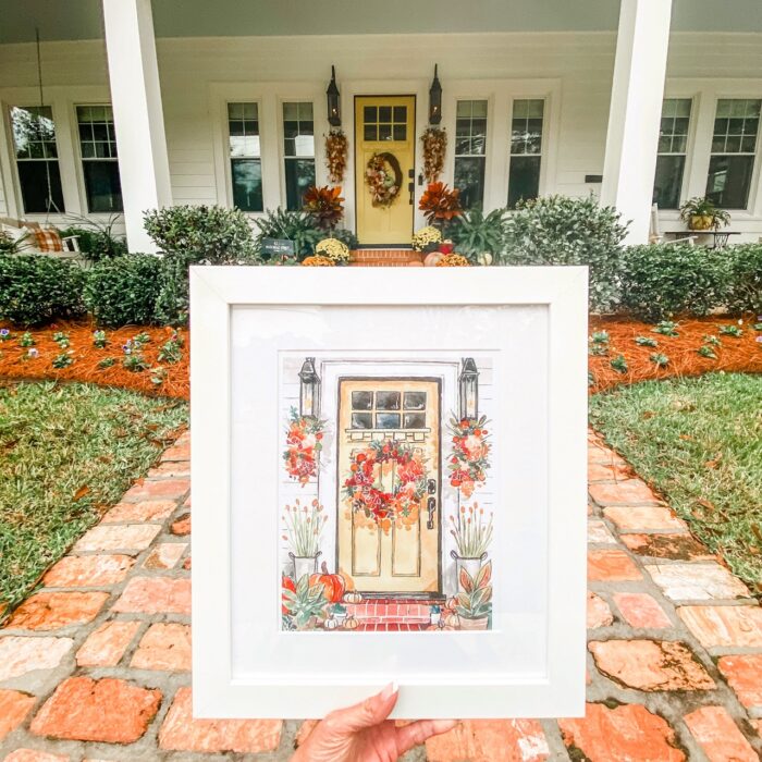 White picture frames featuring a house illustration