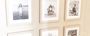 gallery wall with neutral wood frames