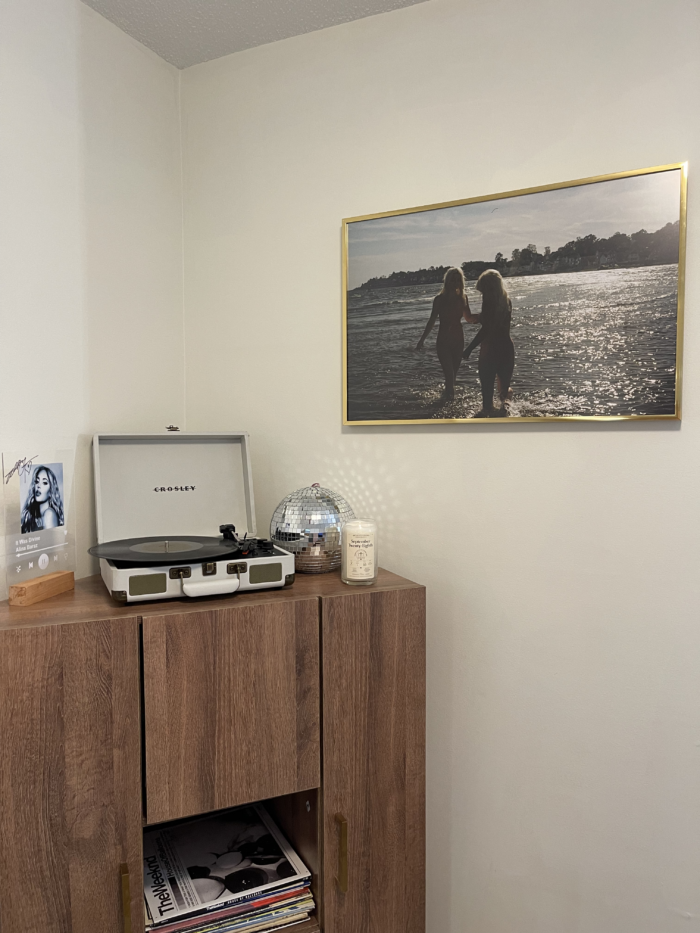 a image of girls playing hung on a bedroom wall