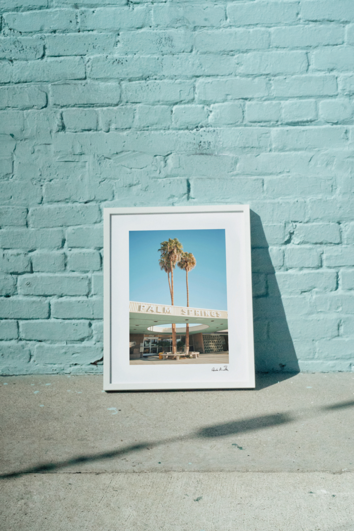 White picture frames featuring palm trees
