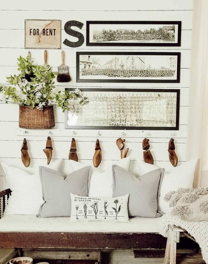 How to Hang a Frame on Any Wall - Stacked frames on wood panel walls
