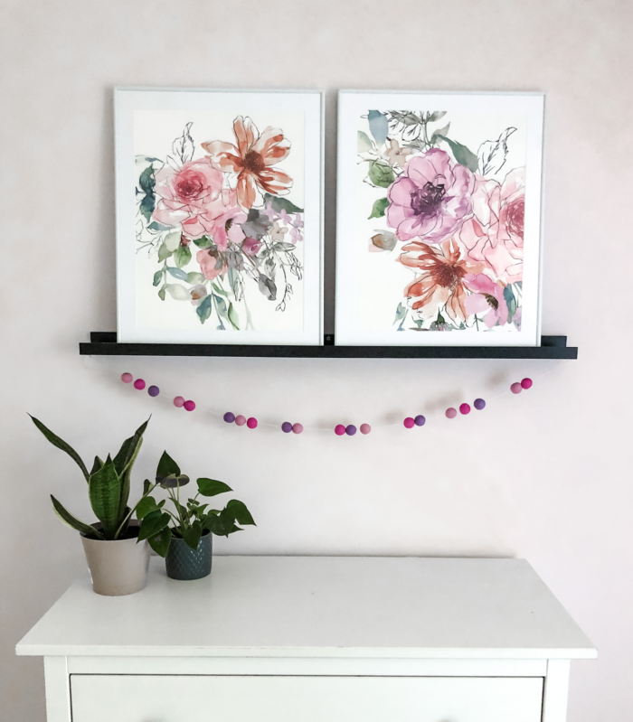 Framed floral paintings add warmth to an employee break room.