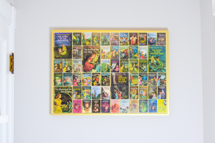 Framed puzzle featuring book covers.