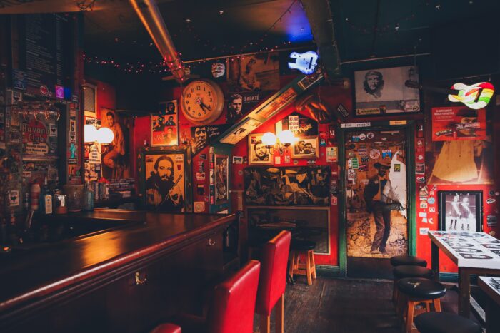 Last Call: Decorating a Bar, Pub, or Tavern - Minimal lighting and bright red walls
