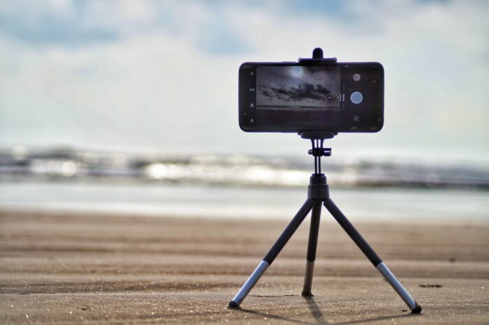 How to take professional headshots: Cell phone on a tripod at the beach.