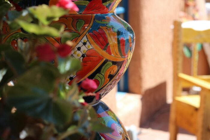 Southwestern decor: A painted clay pot sitting outside in the southwest.