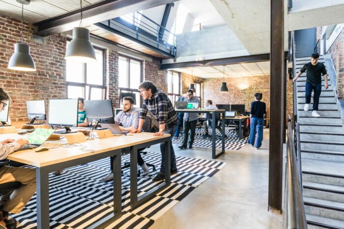 Industrial design style, office with employees working at computers